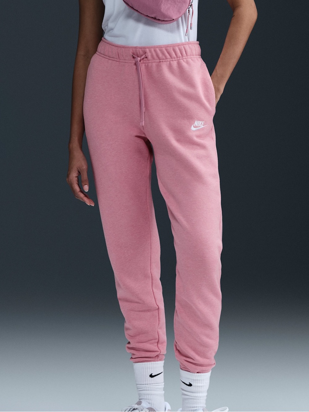 Nike Sportswear Club Fleece Mid-Rise Slim Jogger in a soft pink Size Small